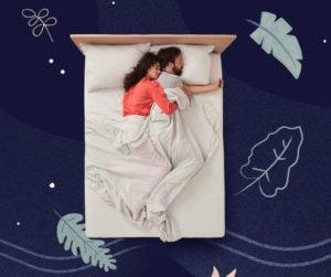 A couple sleeping on a white Casper mattress.