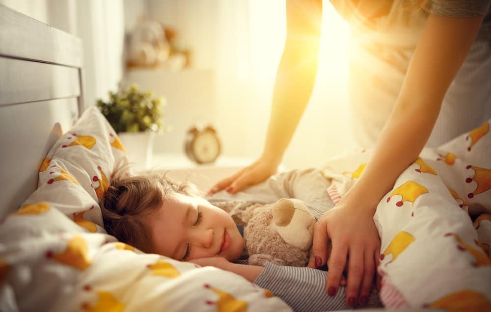 Young Girl Being Woken by Mother