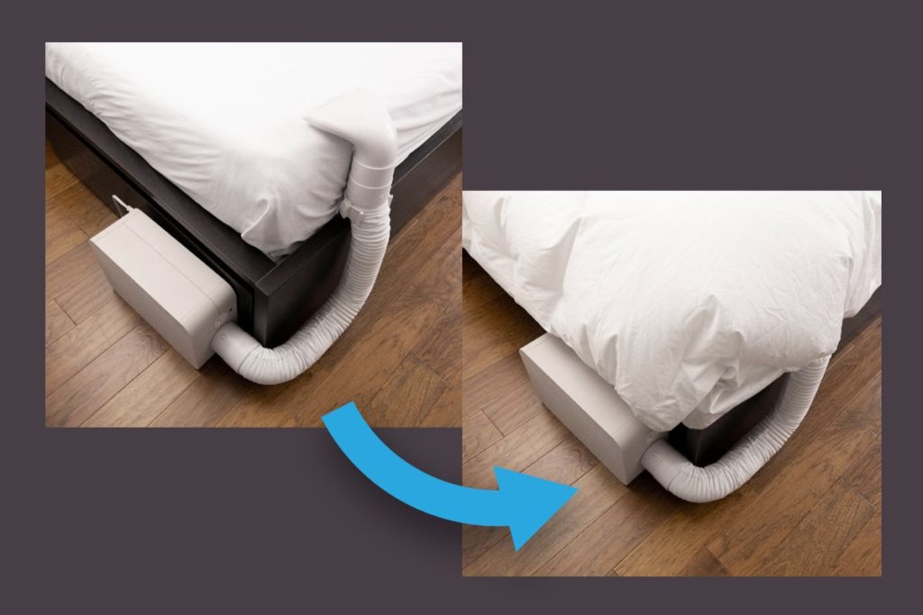 A white BedJet C-Clamp installed on a white bed sheet.