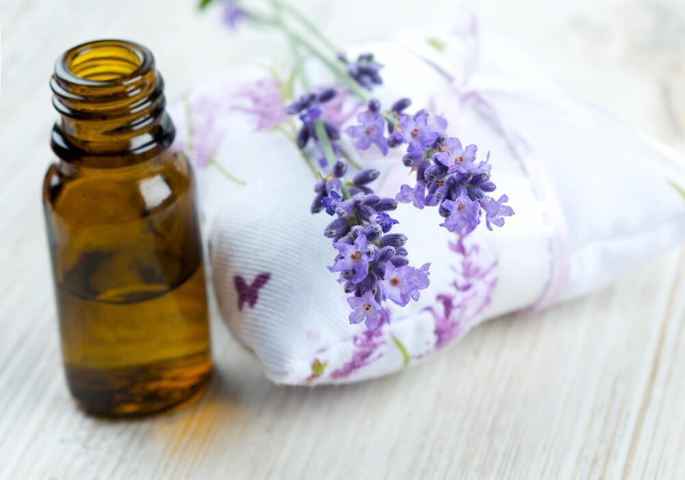 lavender essential oil on wooden surface