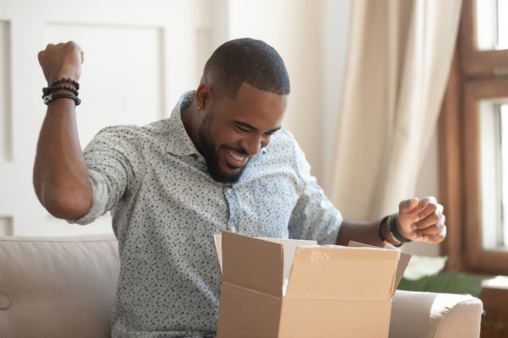 A man opening a box.