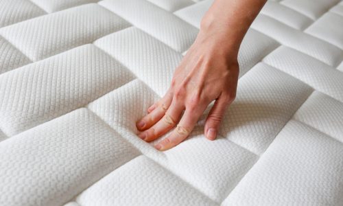 Cropped,Shot,Of,Young,Woman’s,Hand,Testing,White,Orthopedic,Mattress Cropped,Shot,Of,Young,Woman's,Hand,Testing,White,Orthopedic,Mattress